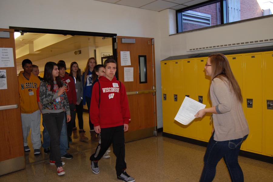 Bridgette Pagano (12) guides the Oakville Middle School 8th graders around their perspective high school. 