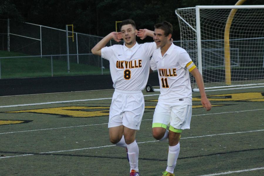 Ahmed Ganibegovic (12) celebrates with Thomas Hutcheson (12) after Ganibegovic scored a goal in the Tigers 3-2 win over Marquette on Sept. 11.
