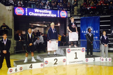 Austin Neal (11) finishes fourth in the 145 lb. weight class at the state wrestling championship in Columbia, MO on Feb. 21.