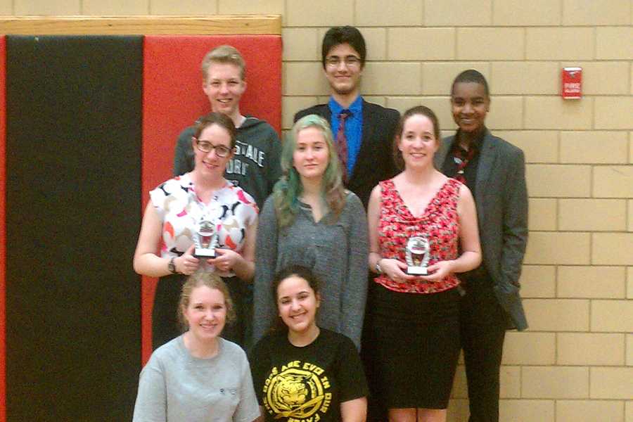 The Speech and Debate team poses for a victory photo. 