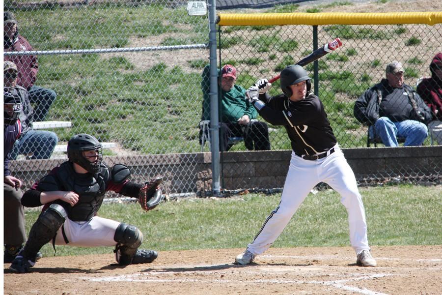 Corey Chambliss (12) bats in a victory over Belleville West on March 28. Chambliss, who is batting .475, missed the past week with a wrist injury.
