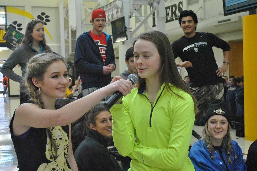 A student steps up to the mic on Hip Hop Day.
