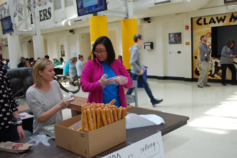 Students from SADD sell Gus Pretzels at lunch.