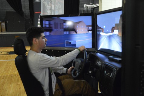 A student tries out the drunk driving simulator.