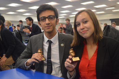 Sohrab Azad (12) and Brooke Mumma (12) pose with their first place trophies. This was their second tournament of the season and the first they competed in together. 