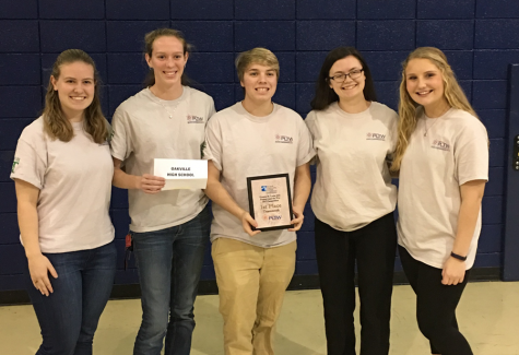 Project Lead the Way (PLTW) students stand with their first place award. 
