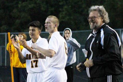 Varsity soccer coach Dave Robben celebrates a goal with Matt Greubel and Samed Ganibegovic in a 3-2 win over Marquette, Sept. 11 at OHS. The victory gave Coach Robben his 500th win as the boys soccer coach at Oakville. This group of guys is special, Robben said.