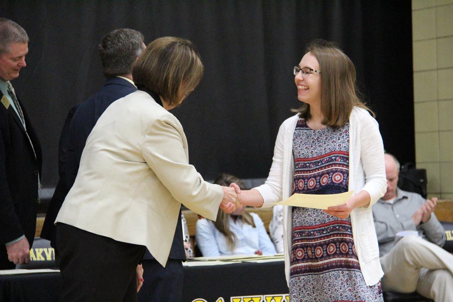 Shaking Principal Jan Kellermans hand, Sierra Hunter (12) accepts her award.