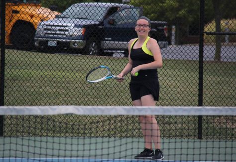 Dalia Dzekic (12) smiles with racquet in hand at the Sept. 12 match against Lafayette.