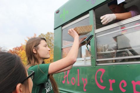 OHS student picks up her crêpe at the Holy Crêpes truck during the 2016 French Week.