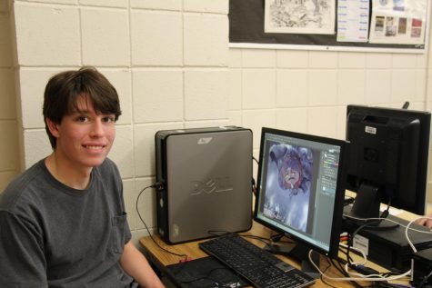 Aaron Bell poses with his digital art.