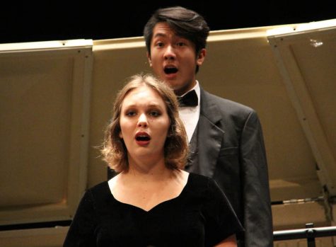 Kristin Steinbrueck (12) and Louis Luong (12) perform in the fall choir concert on Nov. 2.