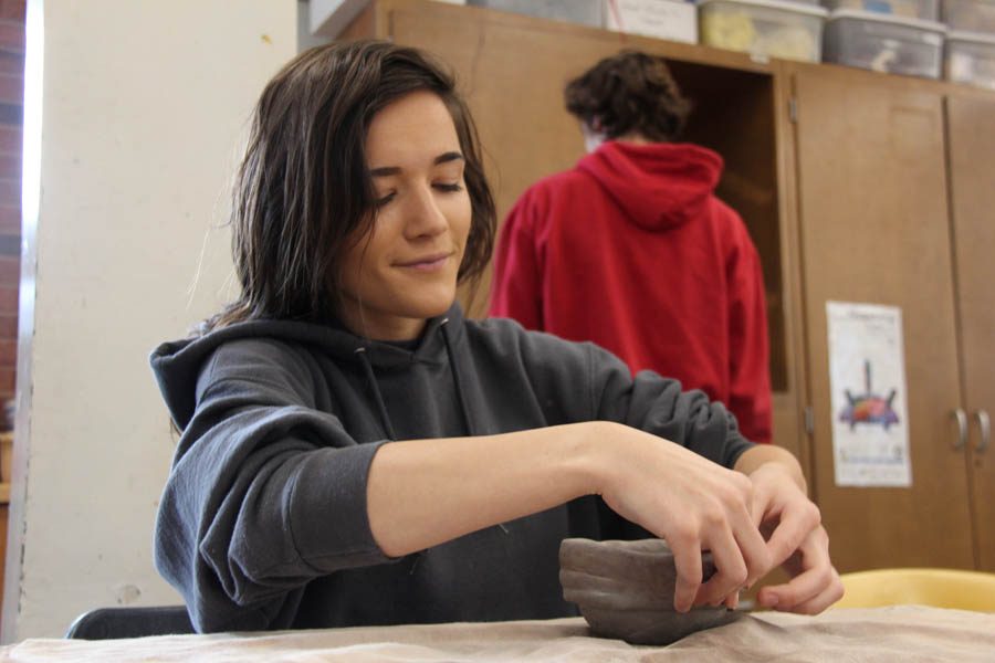 Sophie Steinke (12) works on her coil pitcher project in ceramics I on Oct. 25. Ceramics is one of many classes that does not have enough time to work on C days.