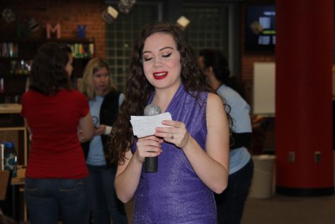 Lilly Jansberg (12) performs as Selena Quintanilla in the library on Dec. 1. Jansberg made her costume by hand.