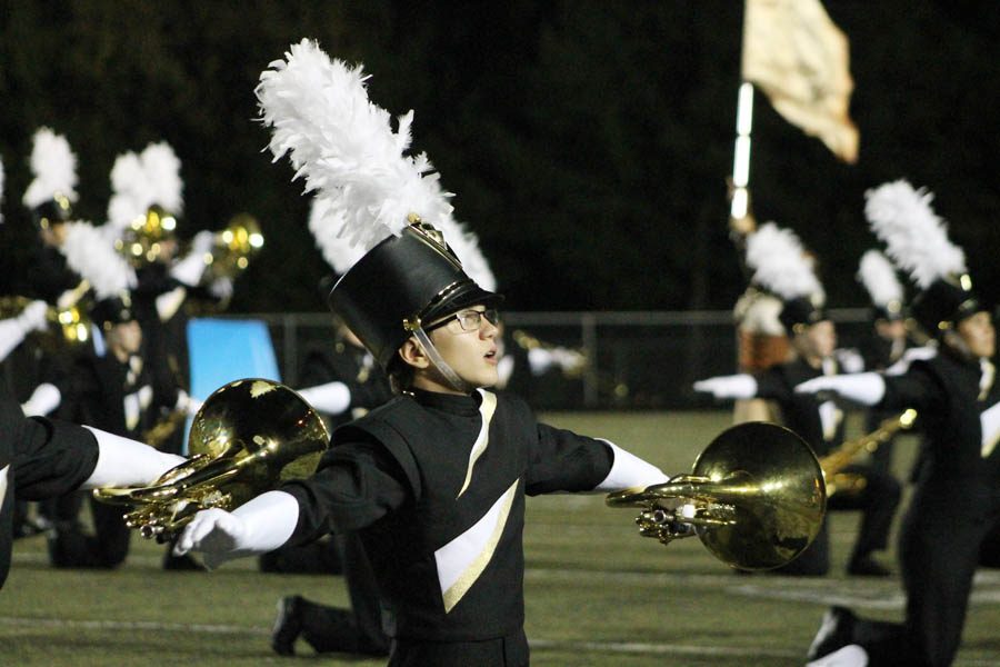 Colin Akers (10) performs during football half time on Sept. 8.