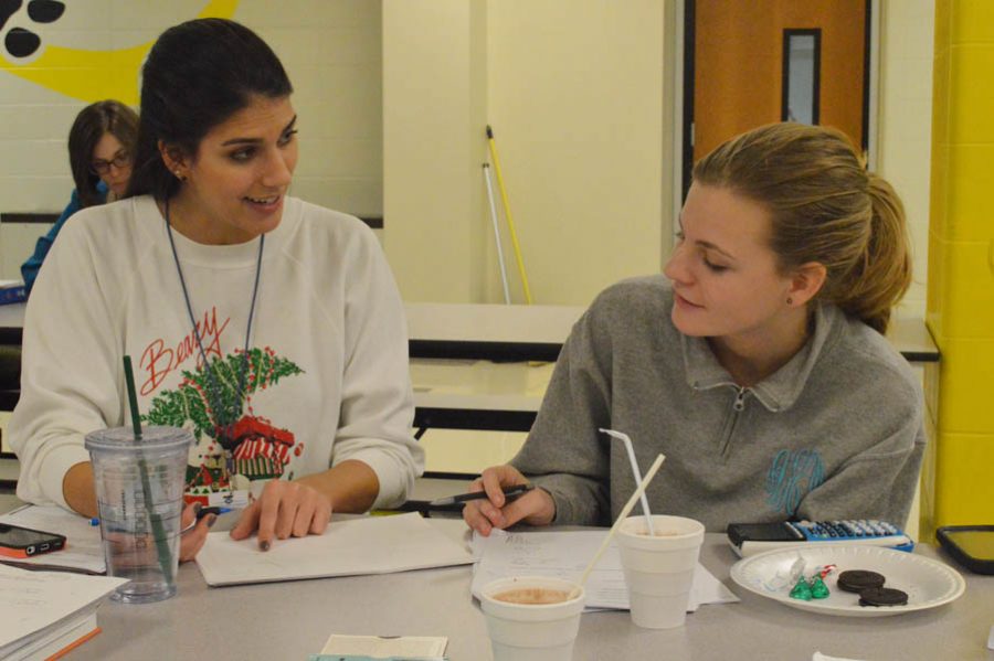 Ms. Samantha Bhambri assists a math student at Cookies, Cocoa, and Cramming on Dec. 15 2015.