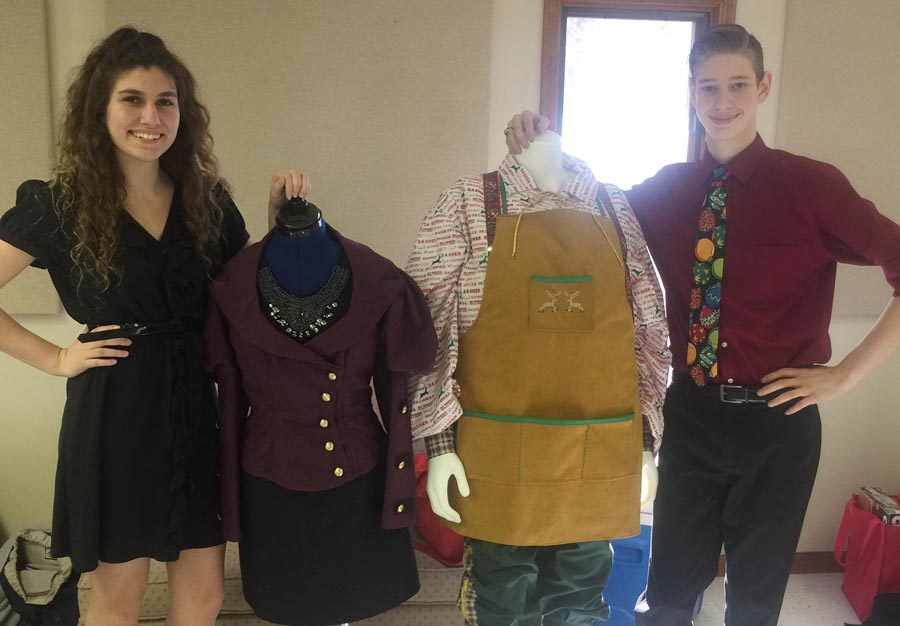 Chloe Willmering (12) and Jacob Kujath (12) pose for a picture with their FCCLA STAR competition pieces they created.