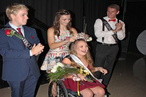 With a big smile on her face, Sophia Martino (12) is crowned Homecoming Queen on Sept. 9.