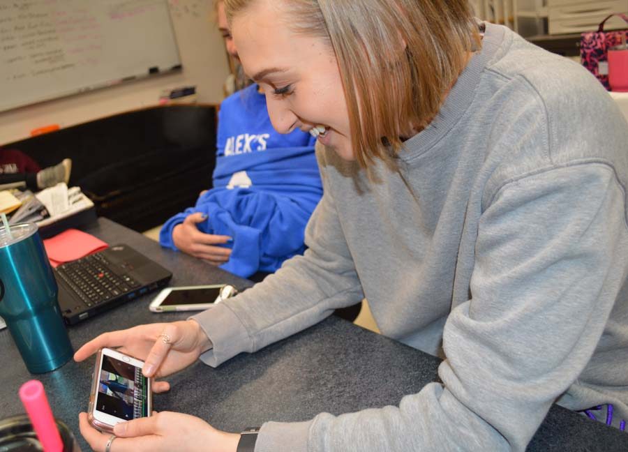 Hannah Baker (12) puts the finishing touches on her project on her phone during ANP on April 16.