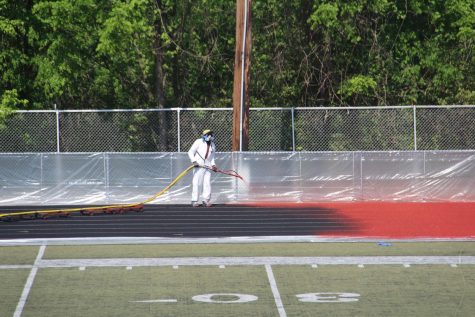 As the school year comes to a close, the track begins to be painted red.