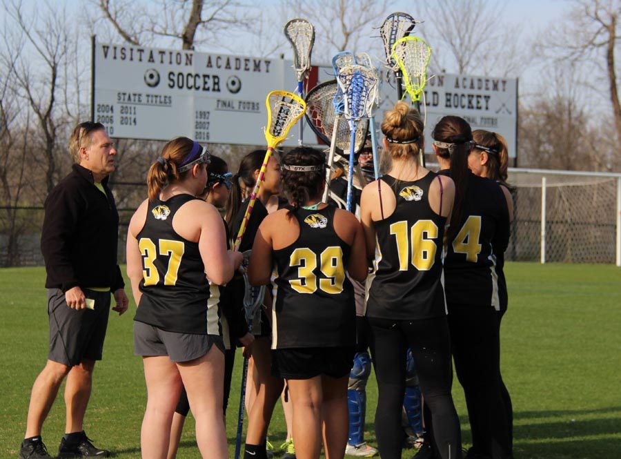 The+girls+lacrosse+team+huddles+before+a+game.