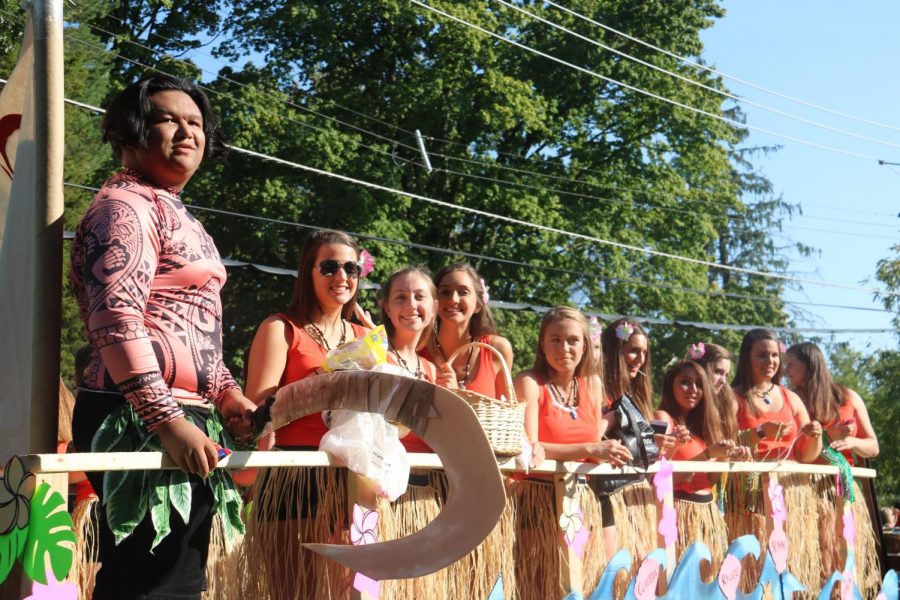 The varsity cheerleaders are all smiles on their Moana themed float during the Homecoming Parade on Sept. 28.
