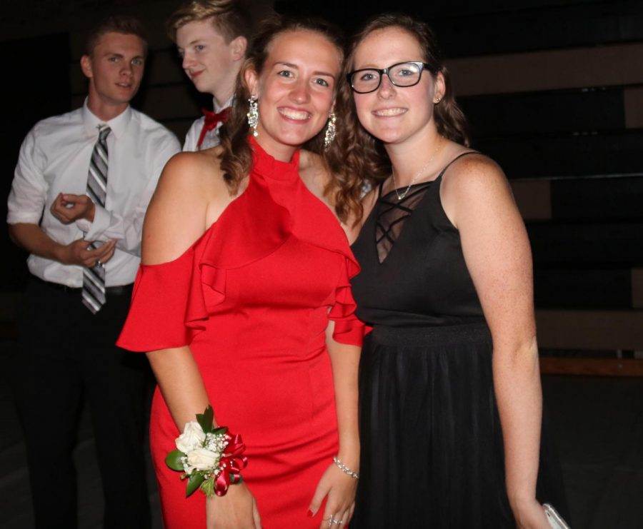 Grace Bellovich (12) and Abbie Schmidt (12) pose for a picture at the Homecoming dance.