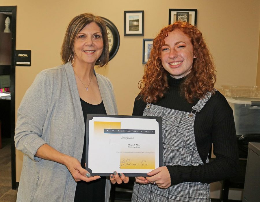 Morgan Allen receives her National Merit certificate after she was announced a semifinalist.
