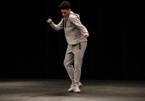 Bryant Igwe (12) shows off his dancing skills on the stage.