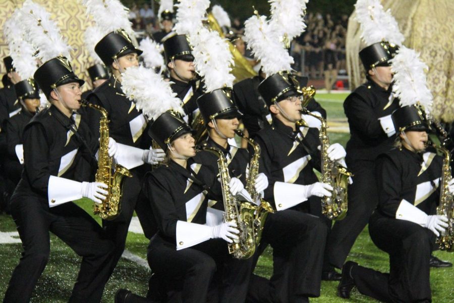 The alto-saxophone section performs during the 2018 show, Bottled Up, during a home football game.