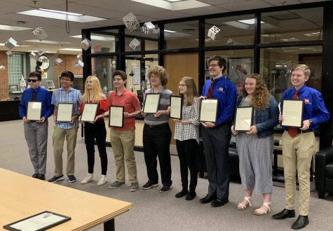 TSA students receive their awards in the OHS library.