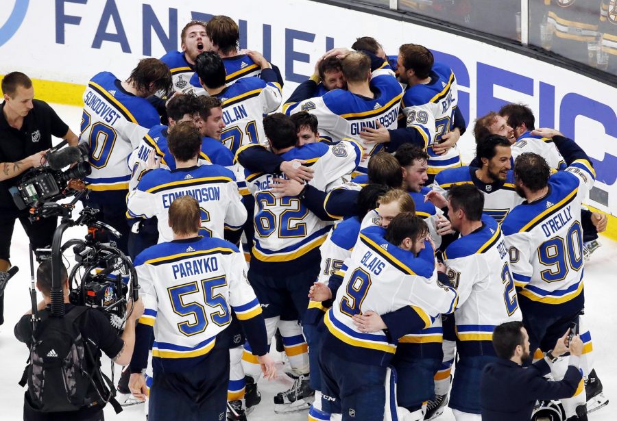 St. Louis Blues exchange hugs as they are named Stanley Cup Champions.