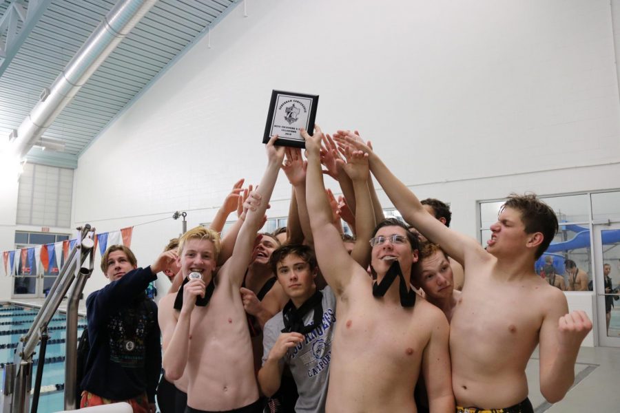 Boys swim celebrates after they won the conference championship on Nov.5.