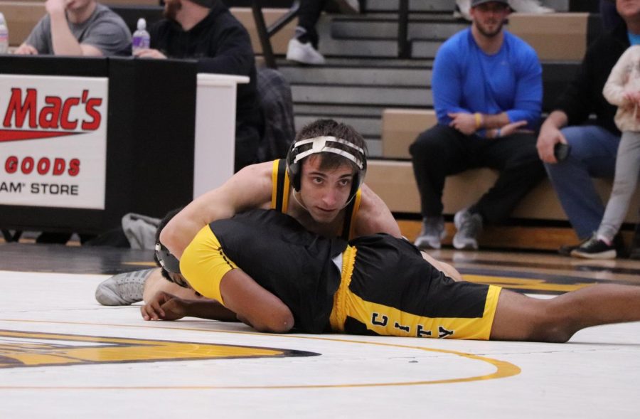 Ibgragim Makhmudov (11) tackles his opponent at a Tri Match against McCluer at OHS on Jan. 5.
