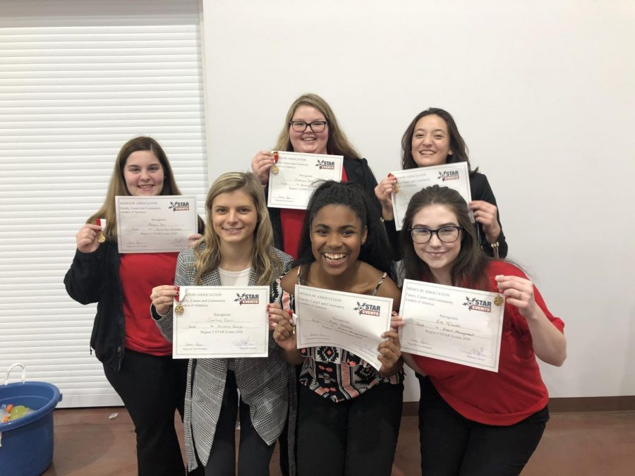 Kayla Jackson (12), Eve Talarski (11), Courtney Doerr (12), Megan Blanchard (11),  Madelynn Turner (12), and Morgan Orr (12) pose for a picture with their gold certificates after receiving news they qualified for state.