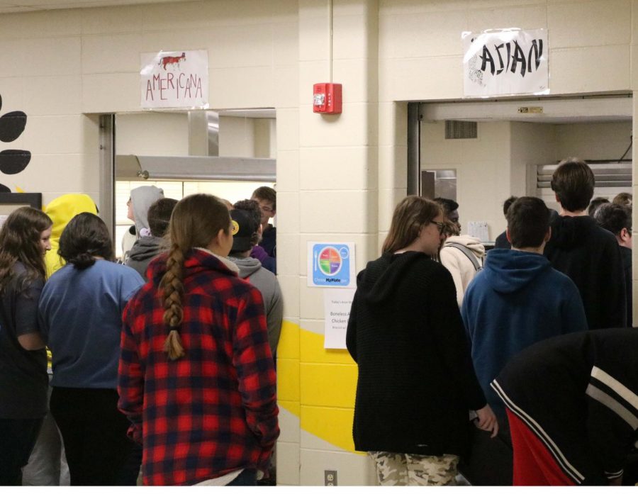 Students wait in one of the new lunch lines at second lunch.