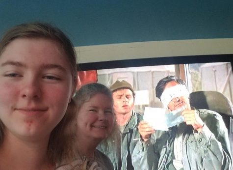 Amber Apetz (11) watching M*A*S*H with her family.