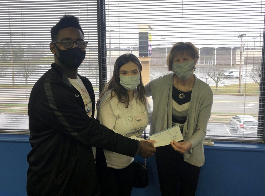 Aman Lueker and Eve Talarski present a check for $315 to Mrs. Marian McCord of CHADS Coalition for Mental Health. Aman and Eve organized a 5K virtual walk/run to raise money for CHADS Coalition. The presentation of the check was made on March 15.