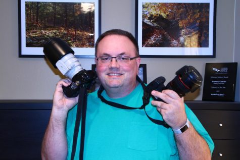 Mr. Gerdes shows off the cameras he uses to capture the beauty in the world around him. 
