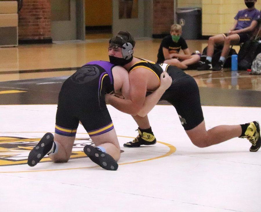 Ethan Venable (9) taking down his opponent during a match against Brentwood.