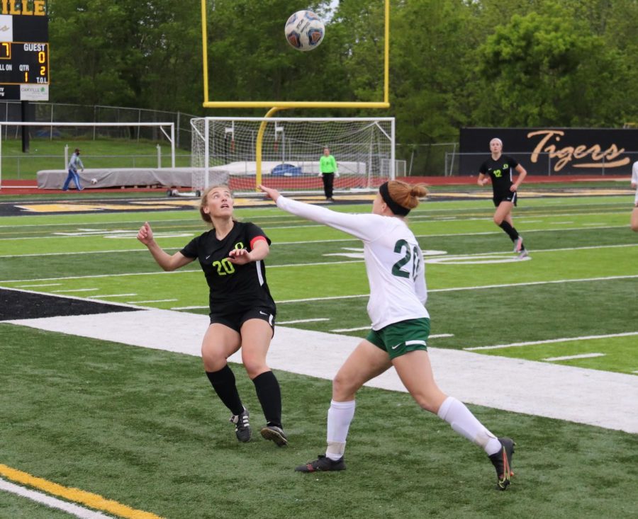 Katie Leeker (12) goes to head butt the ball during her senior night game against Marquette on May,11. Unfortunately the Tigers fell short to the Mustangs 2-1.