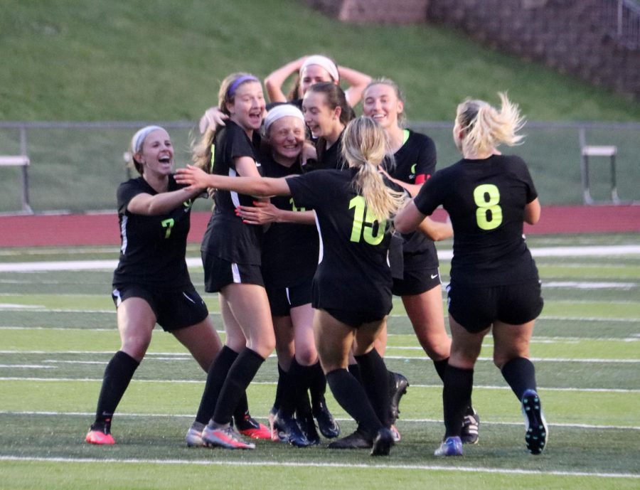 OHS+Girls+soccer+celebrates+with+Paige+Lurkins+%2811%29+after+scoring+the+game+winning+goal+against+Eureka+in+overtime+on+May+4.+The+1-0+win+over+Eureka+advances+their+winning+streak+to+11+games.