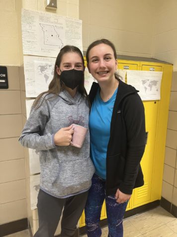 Kelley Akers (9) poses for a photo with Ellie Curcuru (9) after being mugged.