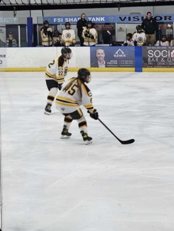 Junior Noelle Glass plays during one of her hockey games. “The sport makes me feel empowered and strong. Besides that, the team being like family is priceless, Glass said. The sweat and practice we share is everything to me”. Glass was offered a scholarship to play hockey in college.
