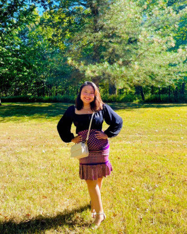 Namitta Phrasalak poses for a photo for Homecoming pictures at Bee Tree Park Oct. 1. I wanted to wear something that represents me, Phrasalak said. She wore a traditional Thai skirt to display her roots.
