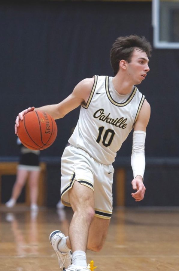 Tommy Hennessy (12) plays in a basketball game at Oakville High School. “This game is so fun, it feels like an art when you’re playing, you feel like you’re moving fluently,” Hennessy said. Hennessy started playing sports before elementary school.