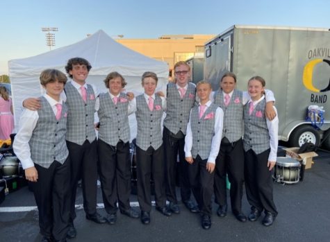 Members of the 2022 drumline pose for a photo before their first performance of the season. It is a lot easier to see them as my friends now, Boehlje said. She was the only female on drumline. 