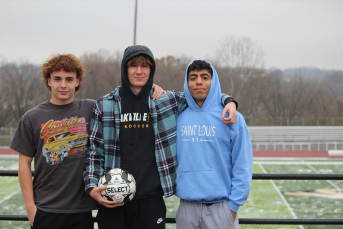 Isaac Lillard (12) Mohammed Al-kenani (12) and Seth Gallagher (12) pose for the Boys Varsity Sign-off Photo. Hard work beats talent any day of the week, Lillard said. The boys considered themselves a family after playing for the soccer team. 