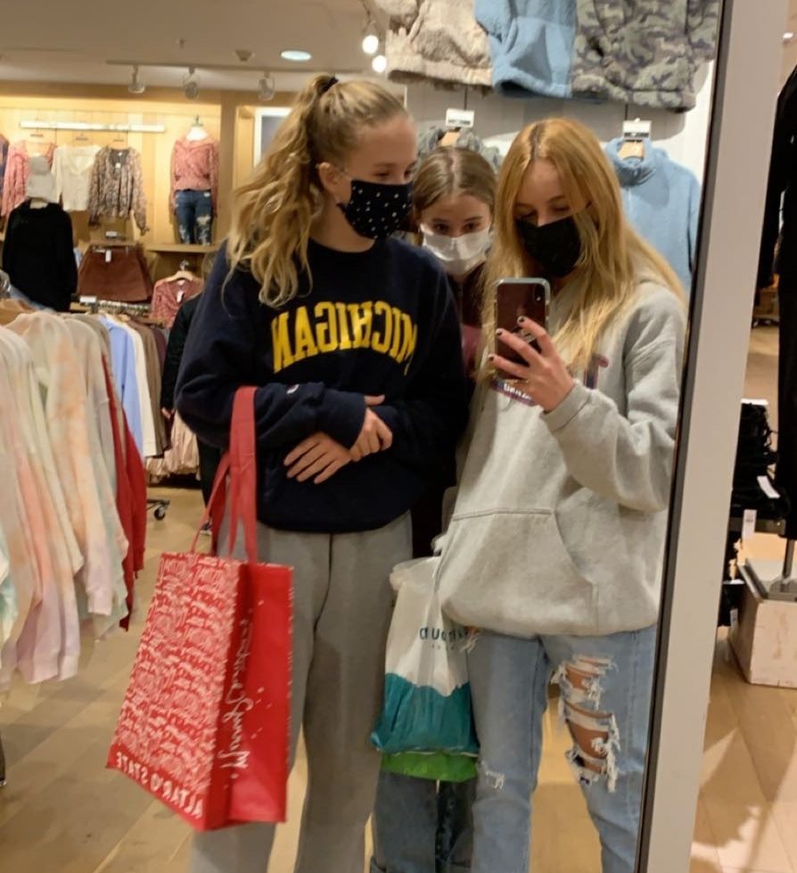 Lucy Caira, Sydney Baker, and Josie Barnett go shopping with new COVID conditions on Black Friday in Nov 2020. 