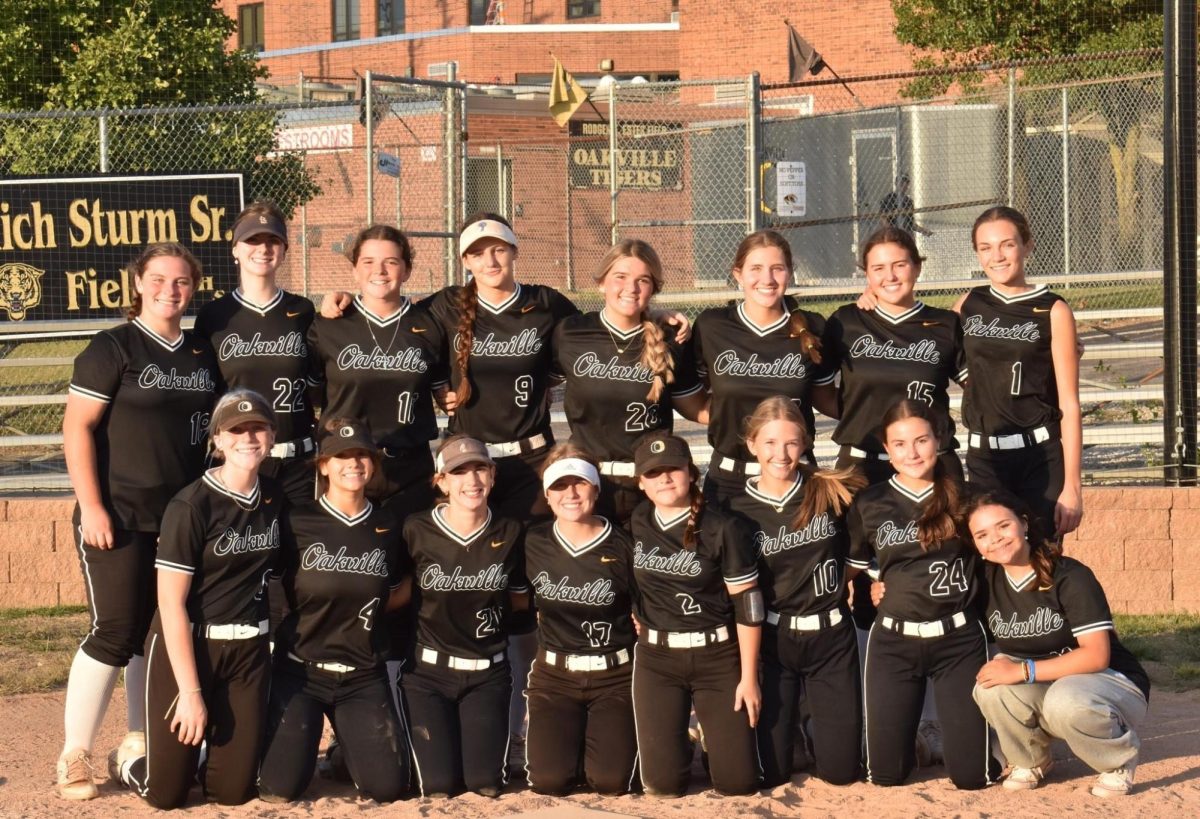Oakvilles varsity softball team poses for a photo after their game on Oct. 14, 2023. For the first time, the softball team had no seniors this year. I think it is just one of those weird things that happens from time to time, coach Richard Sturm said.
